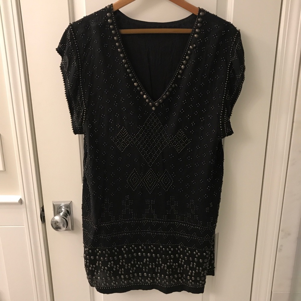 Black dress with brass embellishments.  Size med.